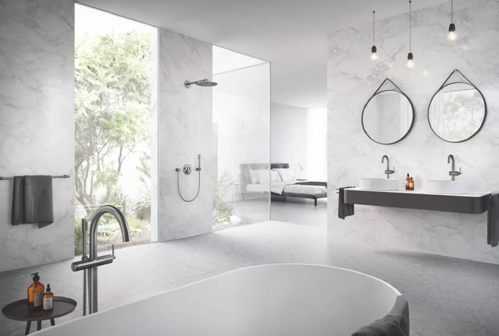 Contemporary bathroom design inspiration featuring a freestanding tub, dual vanities with unique mirrors, and a walk-in shower with modern fixtures.