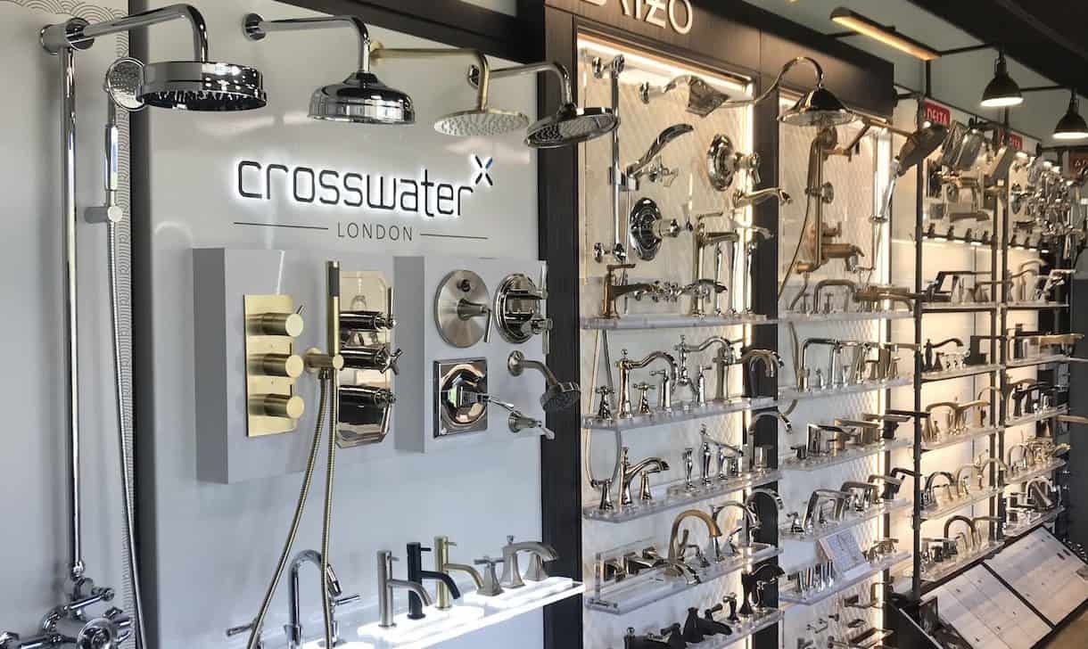 Showroom display of shower heads and faucets