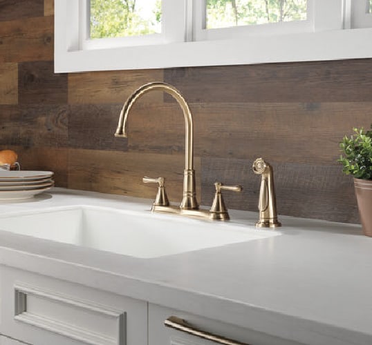 Looking for kitchen upgrade ideas? These satin two-knob kitchen faucet is giving traditional style in the classiest of ways.
