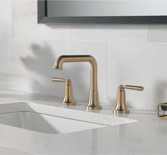 satin brass bathroom faucets bring an elegant, classy look to your space. Find more bathroom design ideas at Coburn's Kitchen & Bath Showroom