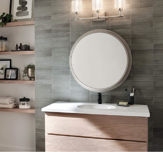 This circular mirror offers just the right amount of "wow" for your next bathroom redesign. Get more bathroom design ideas at a Coburn's Kitchen & Bath Showroom.