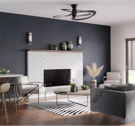 Unique ceiling fan ideas for your next living room remodel project. Featuring a dark, rounded-blade ceiling fan in a modern living room setting.
