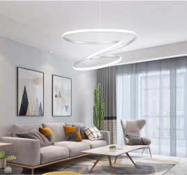 Modern lighting options for your next living room remodel project. Featuring a twisted hoop pendant lighting fixture within a modern living room setting.
