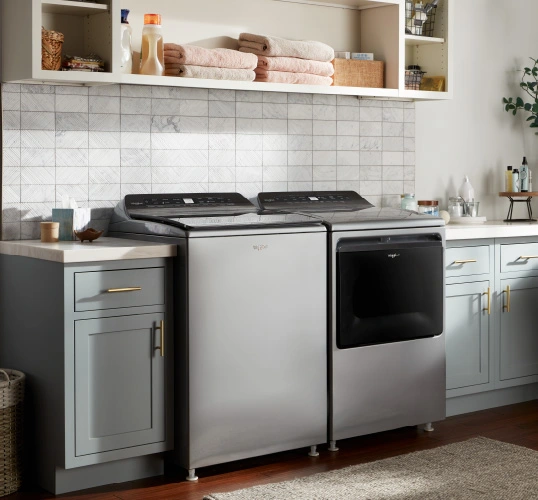 Laundry room appliances featuring a sleek gray washer and dryer set.