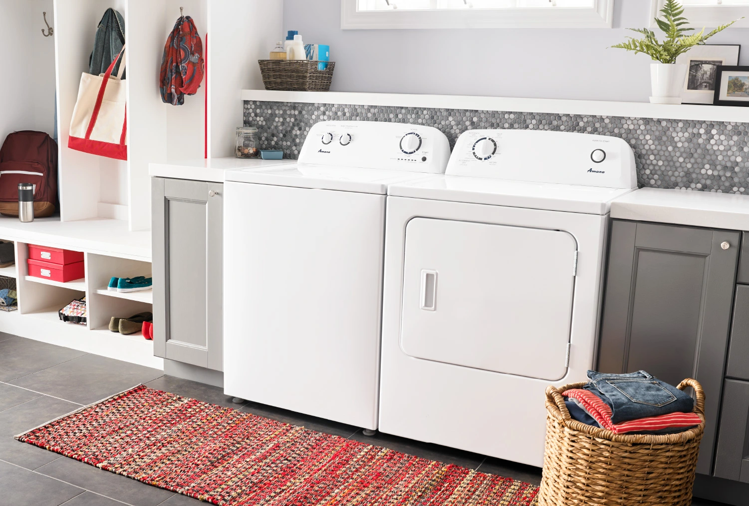 Laundry room makeover ideas for your home, featuring a white washer and dryer set with plenty of laundry room storage options.